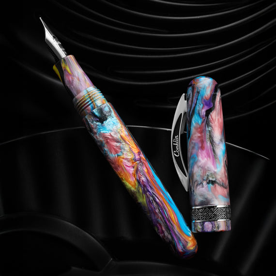 The image shows a Conklin 1898 fountain pen featuring stunning resin swirled in an assortment of colors and has a matte finish. It has chrome trim and is part of a limited edition.