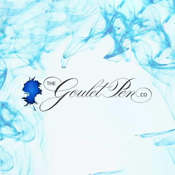 Blue ink splashes with 'The Goulet Pen Co' logo on a light blue background