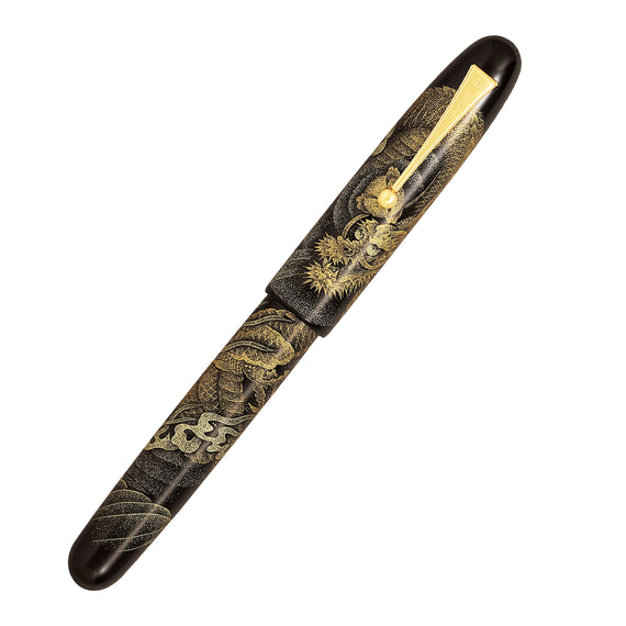 Decorative black and gold pen on a white background