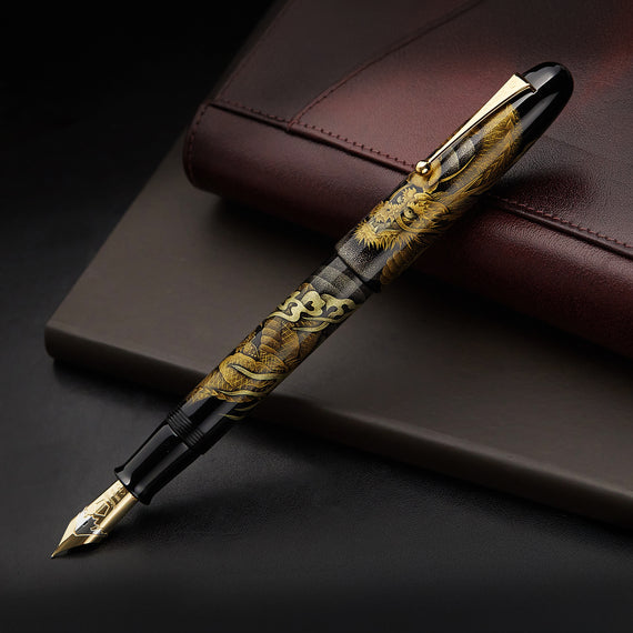 Decorative black and gold pen on a white background