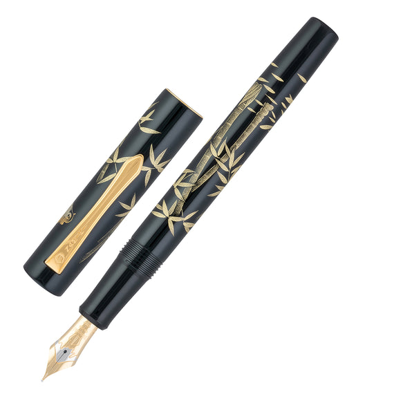 Black fountain pen with gold accents on a white background