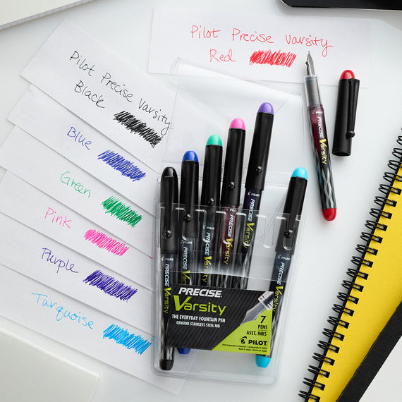 Pilot Precise Varsity fountain pens with packaging on a white surface.