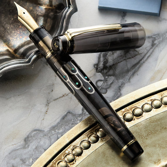 Luxury fountain pen with gold accents on a marble surface