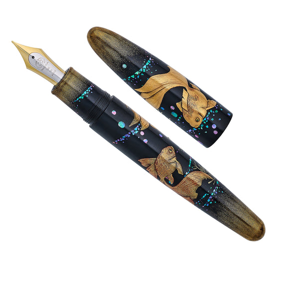 Fountain pen with goldfish design on a white background